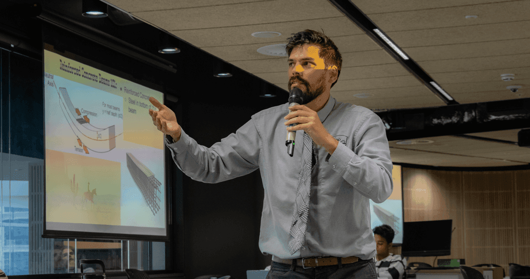 Tim Polo lecturing in front of a class during an in-person Claroe training session